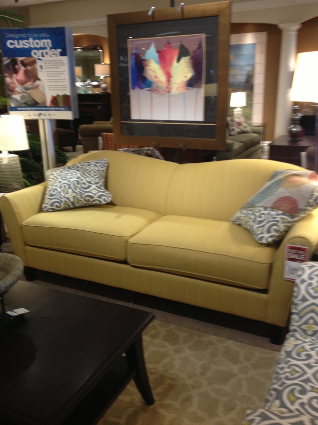 We bought this couch.  But NOT in this yellow colour :) With upgraded fabric and cushions and taxes it was $1200.  